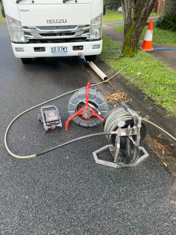 CCTV drain camera reel, monitor and high-pressure jetting equipment set up kerbside at a blocked drain job on the Gold Coast